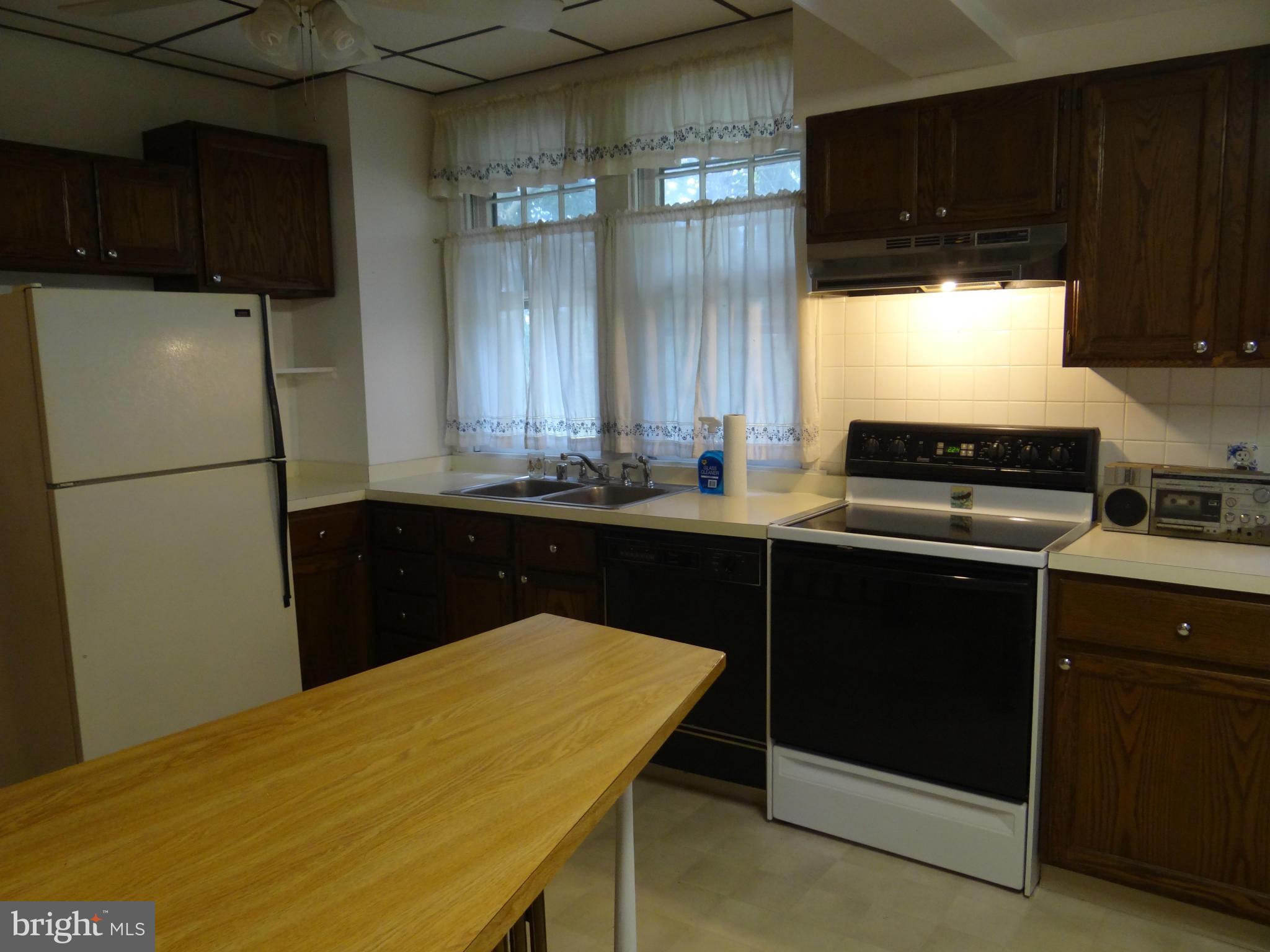2902 Ridge Road Baltimore, MD 21244 - Photo 7 of 23 a kitchen with a sink and cabinets