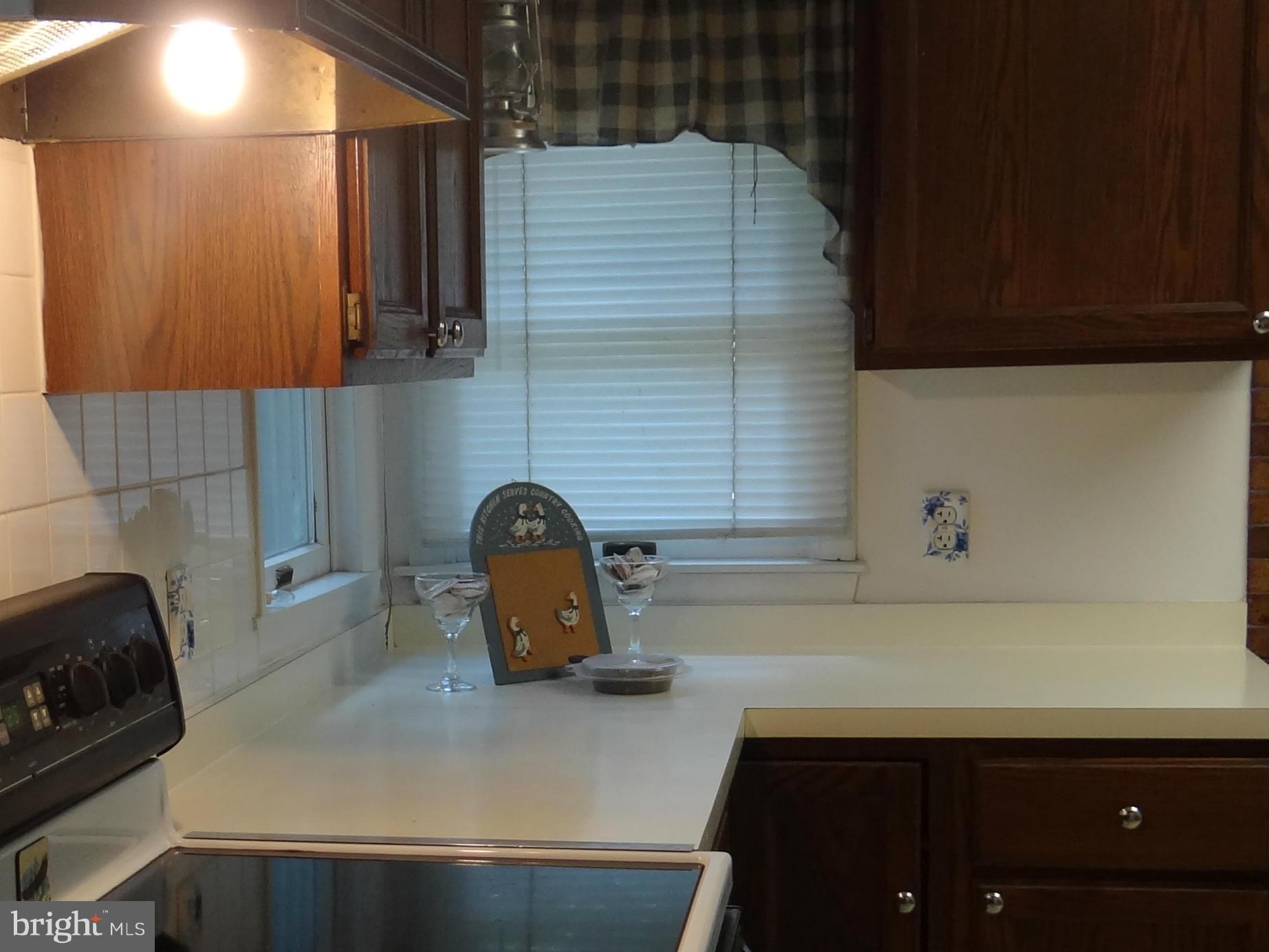 2902 Ridge Road Baltimore, MD 21244 - Photo 8 of 23 a bathroom with a sink and a mirror
