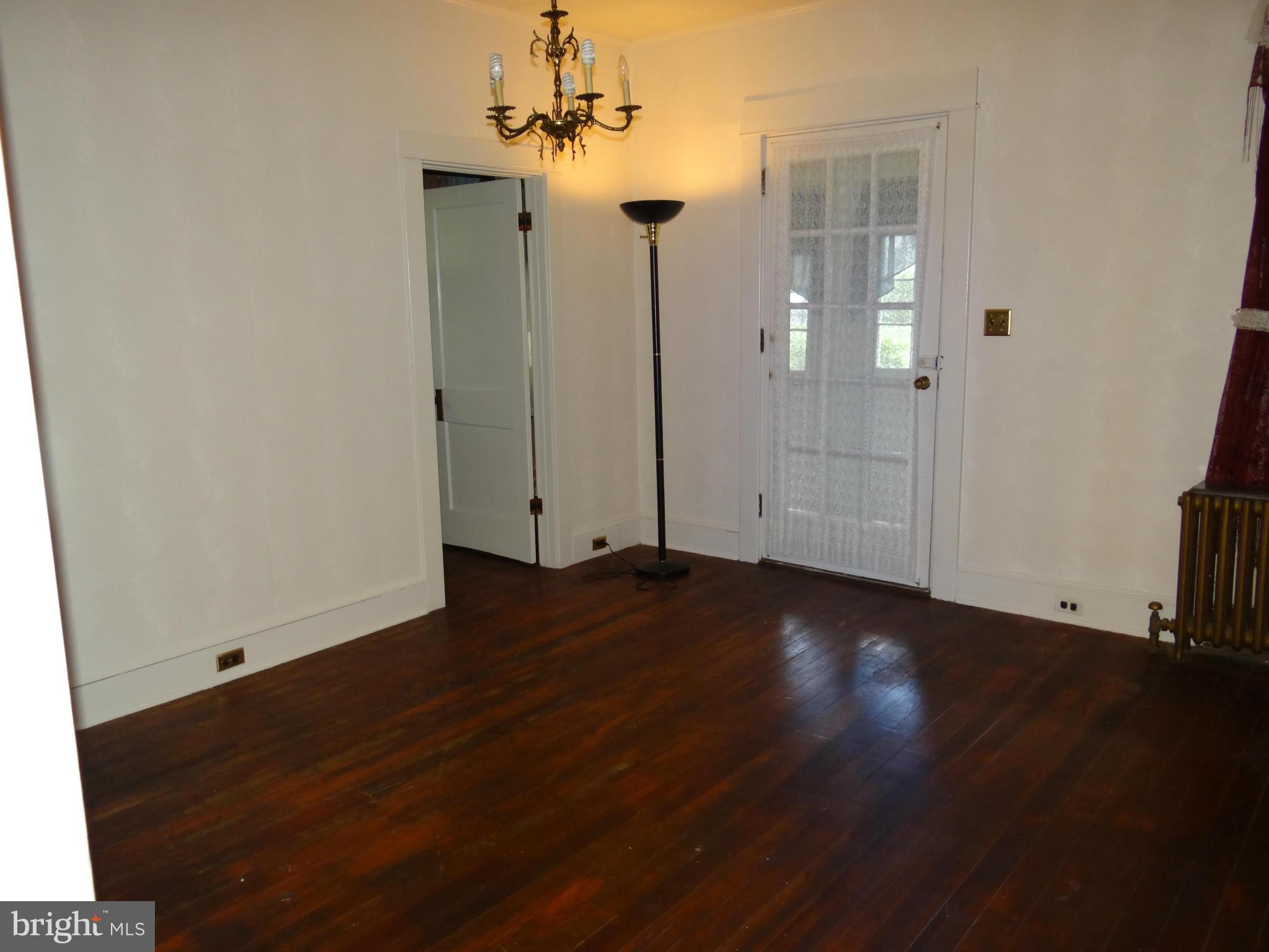 2902 Ridge Road Baltimore, MD 21244 - Photo 9 of 23 a view of a room with wooden floor and windows