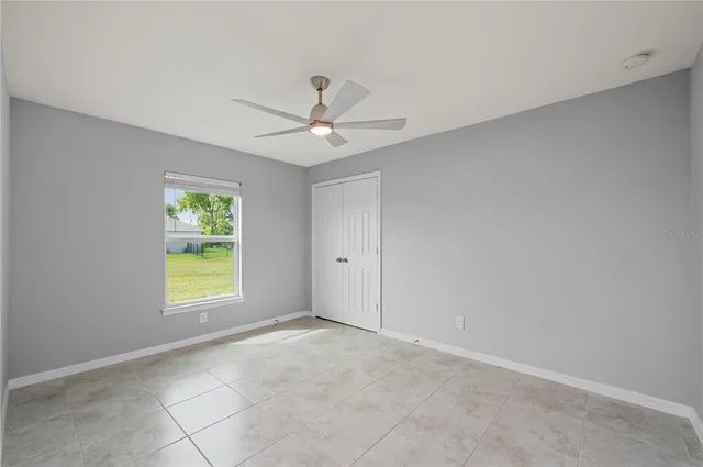 a view of an empty room with a window