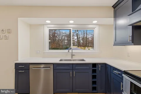 a kitchen with a sink and a window