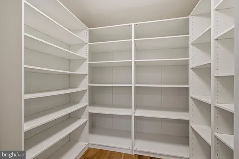 a workspace with furniture and wooden floor