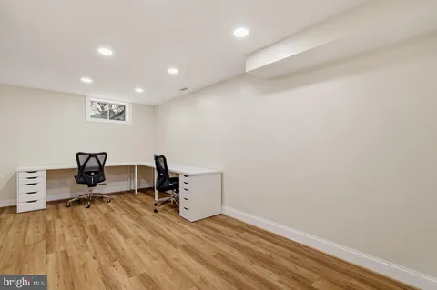 a view of workspace with wooden floor and chair