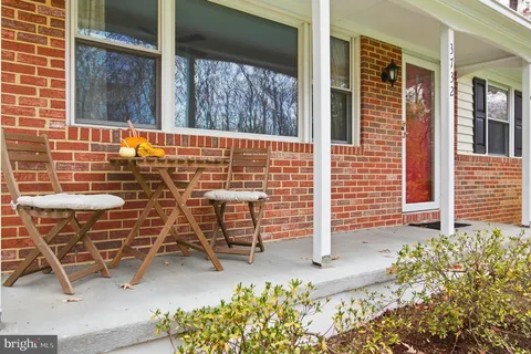 front view of a brick house with an outdoor space