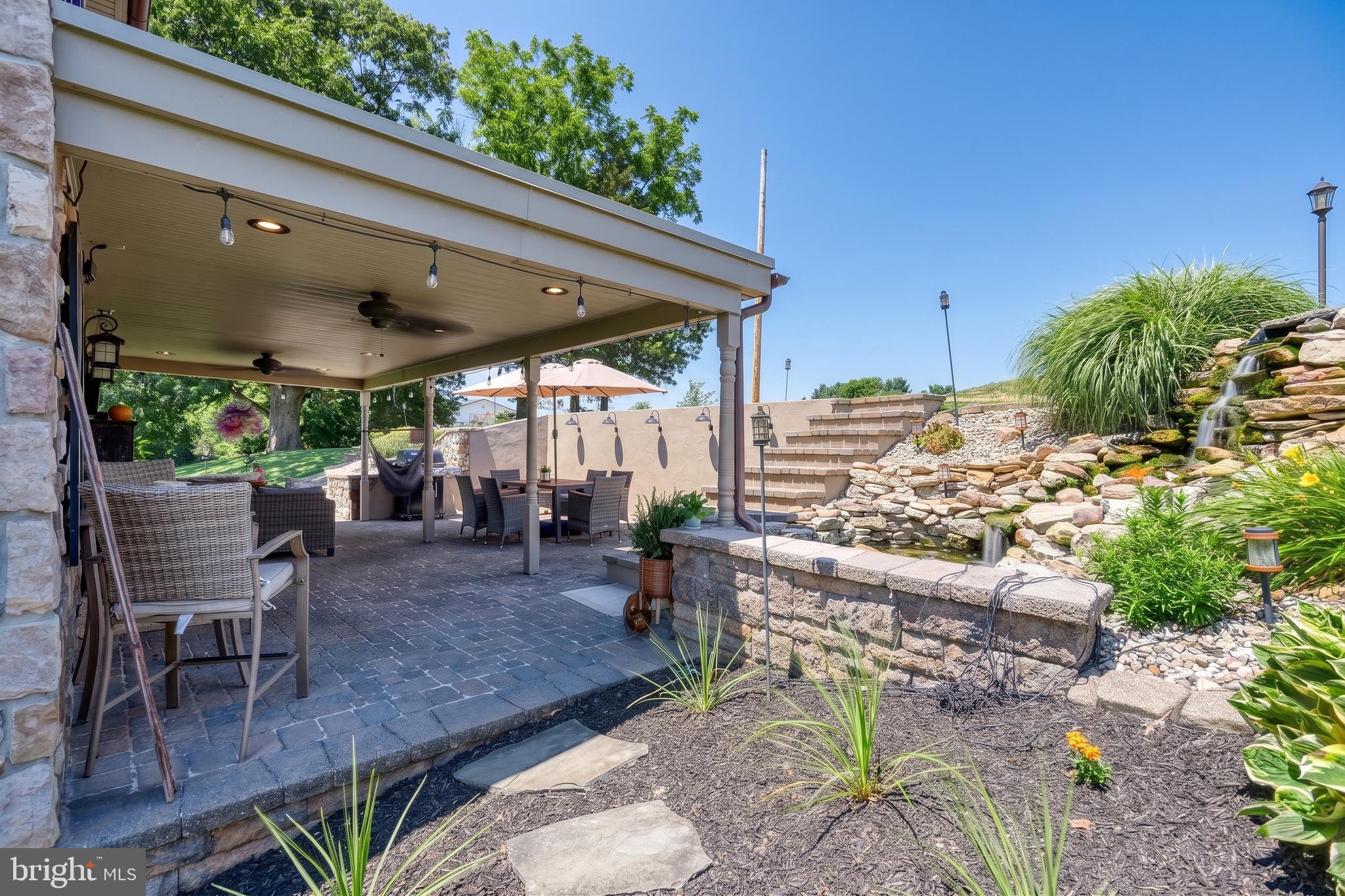 2415 Clearview Lane Spring Grove, PA 17362 - Photo 39 of 149 a view of a patio with a table and chairs under an umbrella