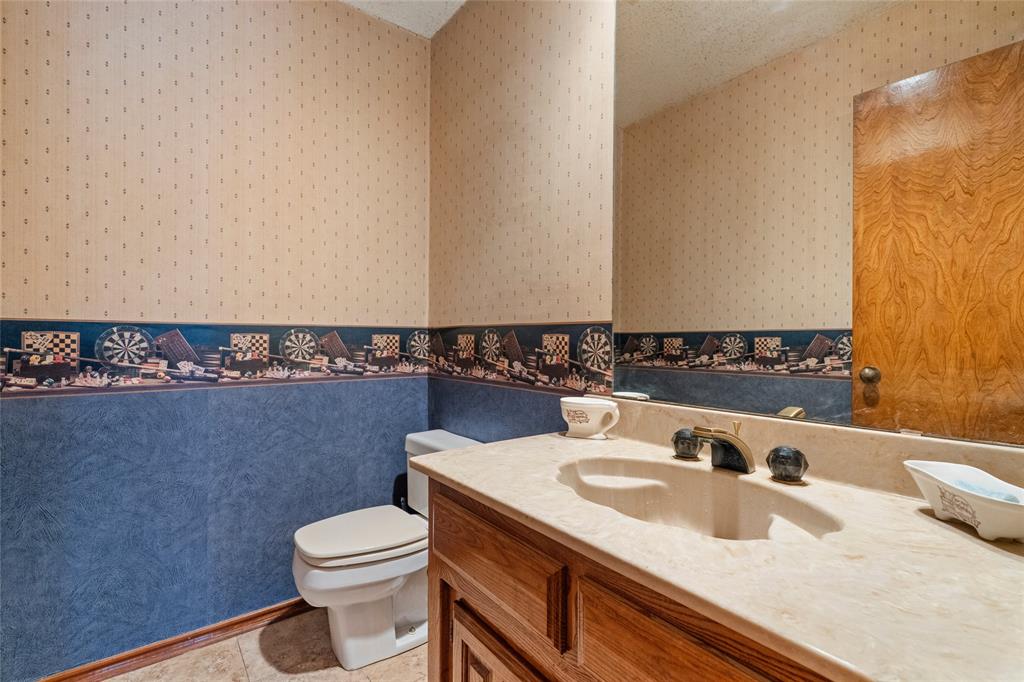 5840 Crystal Drive Midlothian, TX 76065 - Photo 14 of 36 a bathroom with a sink and a toilet