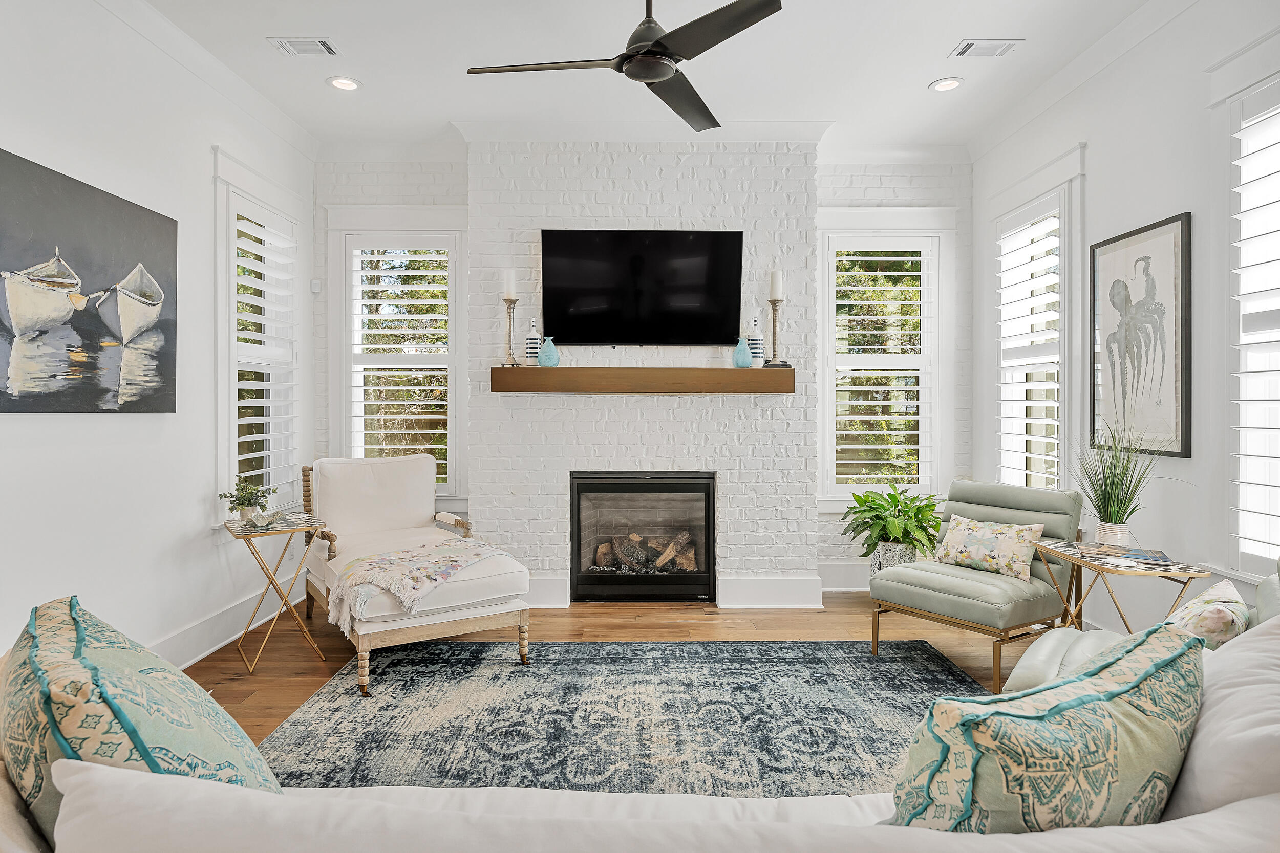 339 Ridgewalk Circle Santa Rosa Beach, FL 32459 - Photo 13 of 57 a living room with furniture a flat screen tv and a fireplace