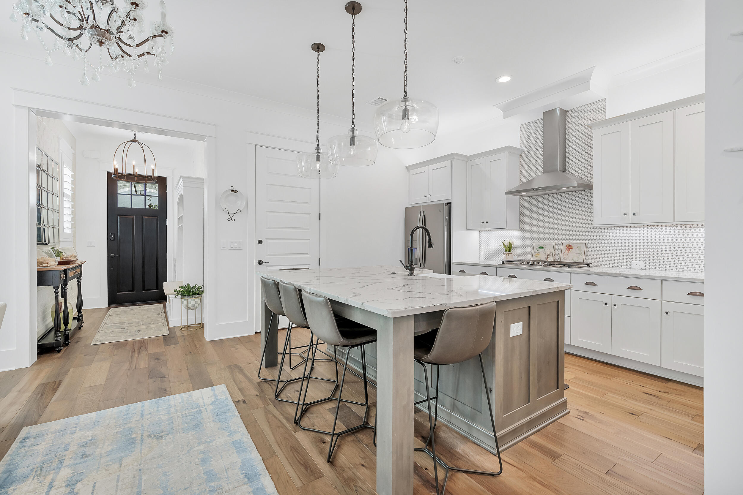 339 Ridgewalk Circle Santa Rosa Beach, FL 32459 - Photo 14 of 57 a kitchen with stainless steel appliances granite countertop a sink a stove a refrigerator and island with wooden floor