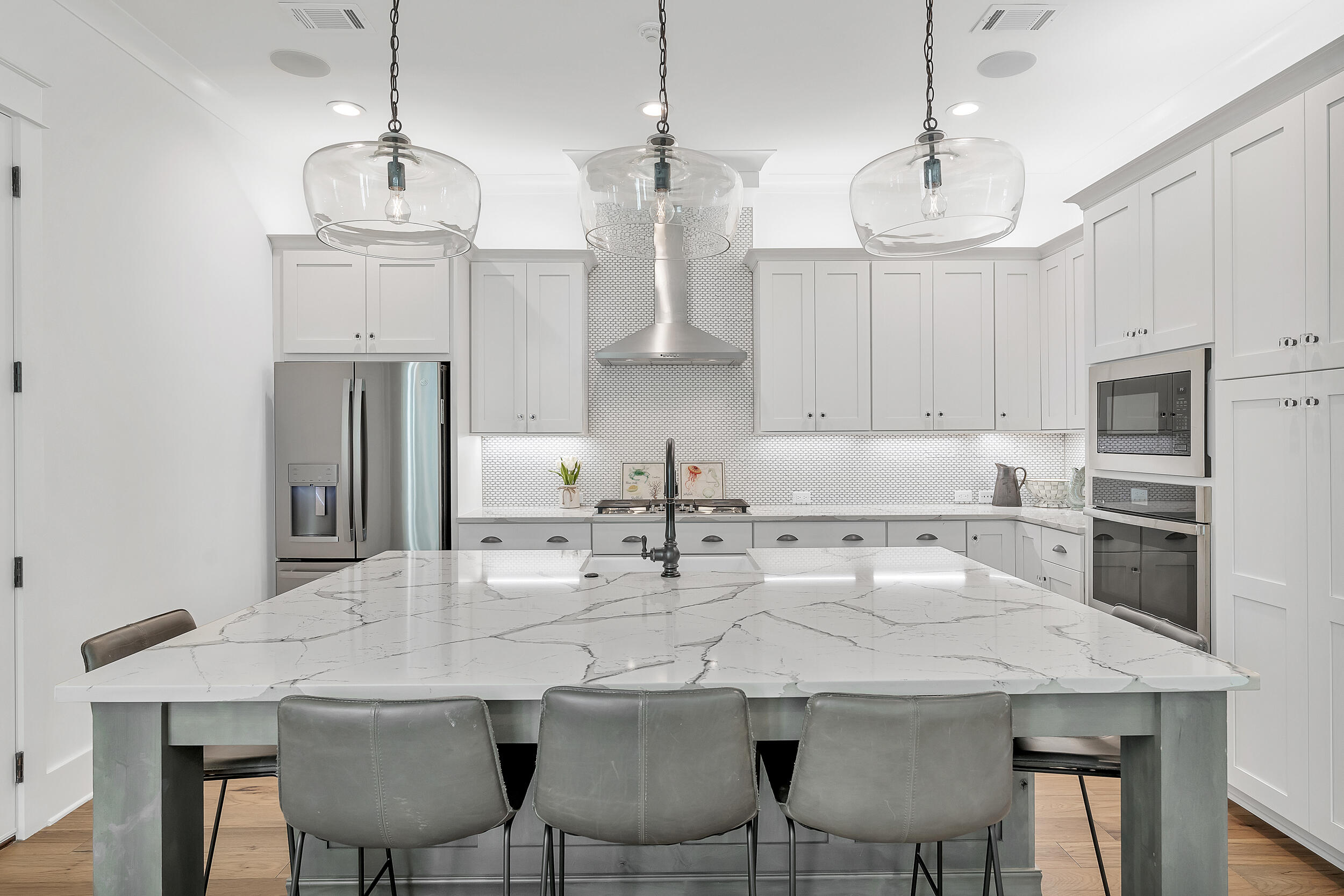 339 Ridgewalk Circle Santa Rosa Beach, FL 32459 - Photo 15 of 57 a kitchen with stainless steel appliances granite countertop a dining table chairs sink and cabinets