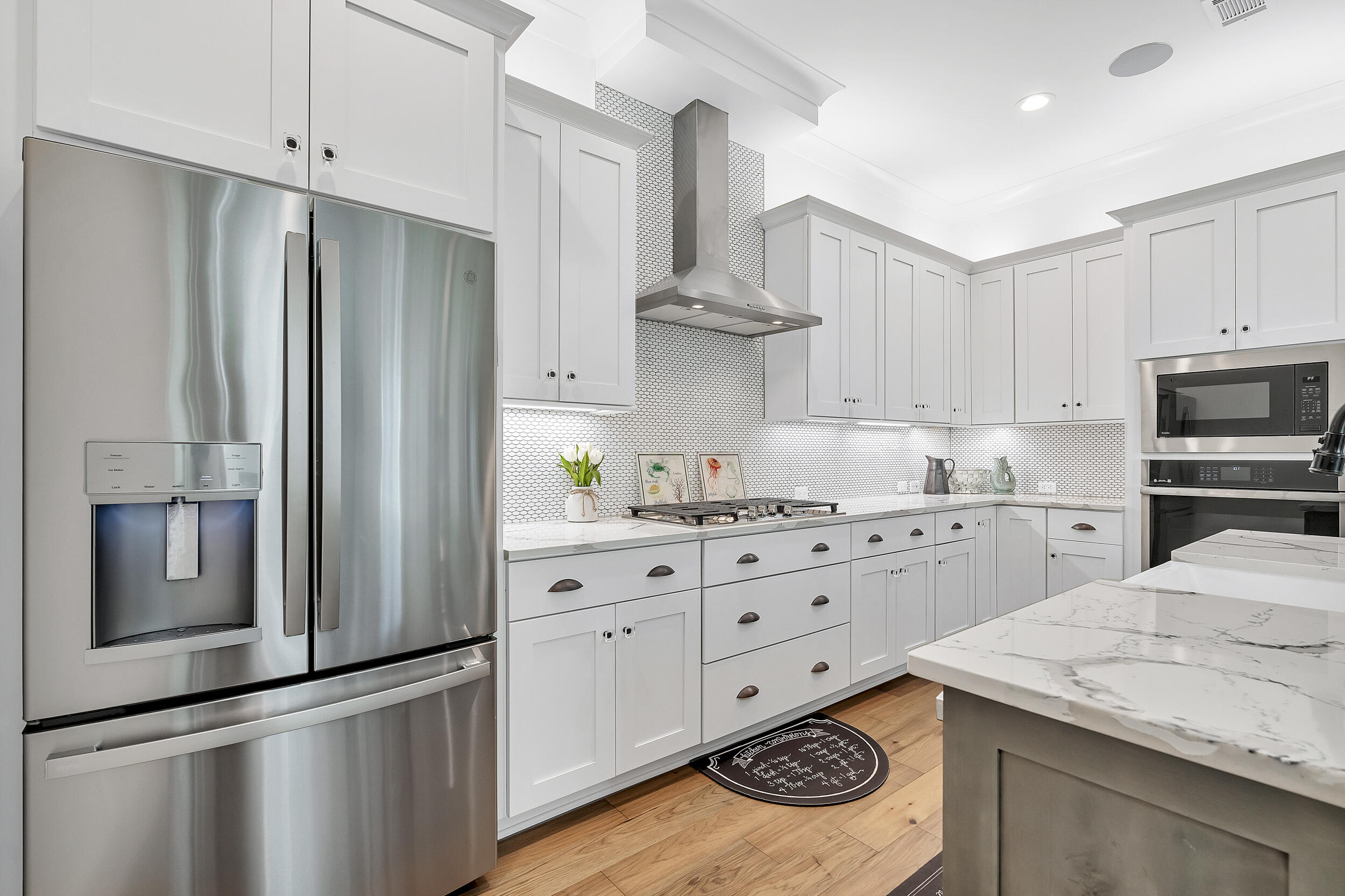 339 Ridgewalk Circle Santa Rosa Beach, FL 32459 - Photo 17 of 57 a kitchen with stainless steel appliances kitchen island a refrigerator sink and cabinets