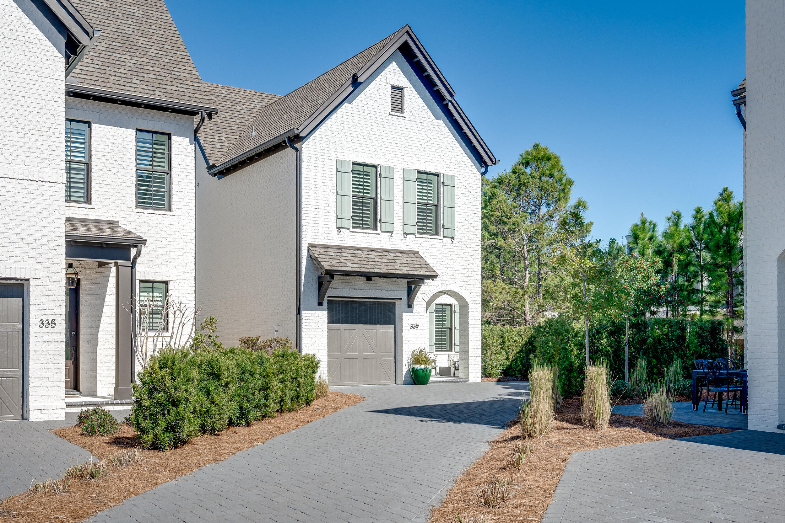 339 Ridgewalk Circle Santa Rosa Beach, FL 32459 - Photo 3 of 57 a front view of a house with garden