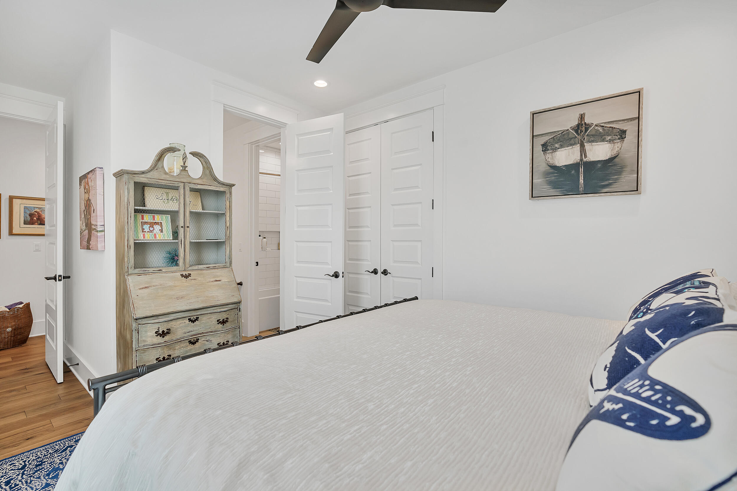 339 Ridgewalk Circle Santa Rosa Beach, FL 32459 - Photo 31 of 57 a bedroom with a bed and a chandelier