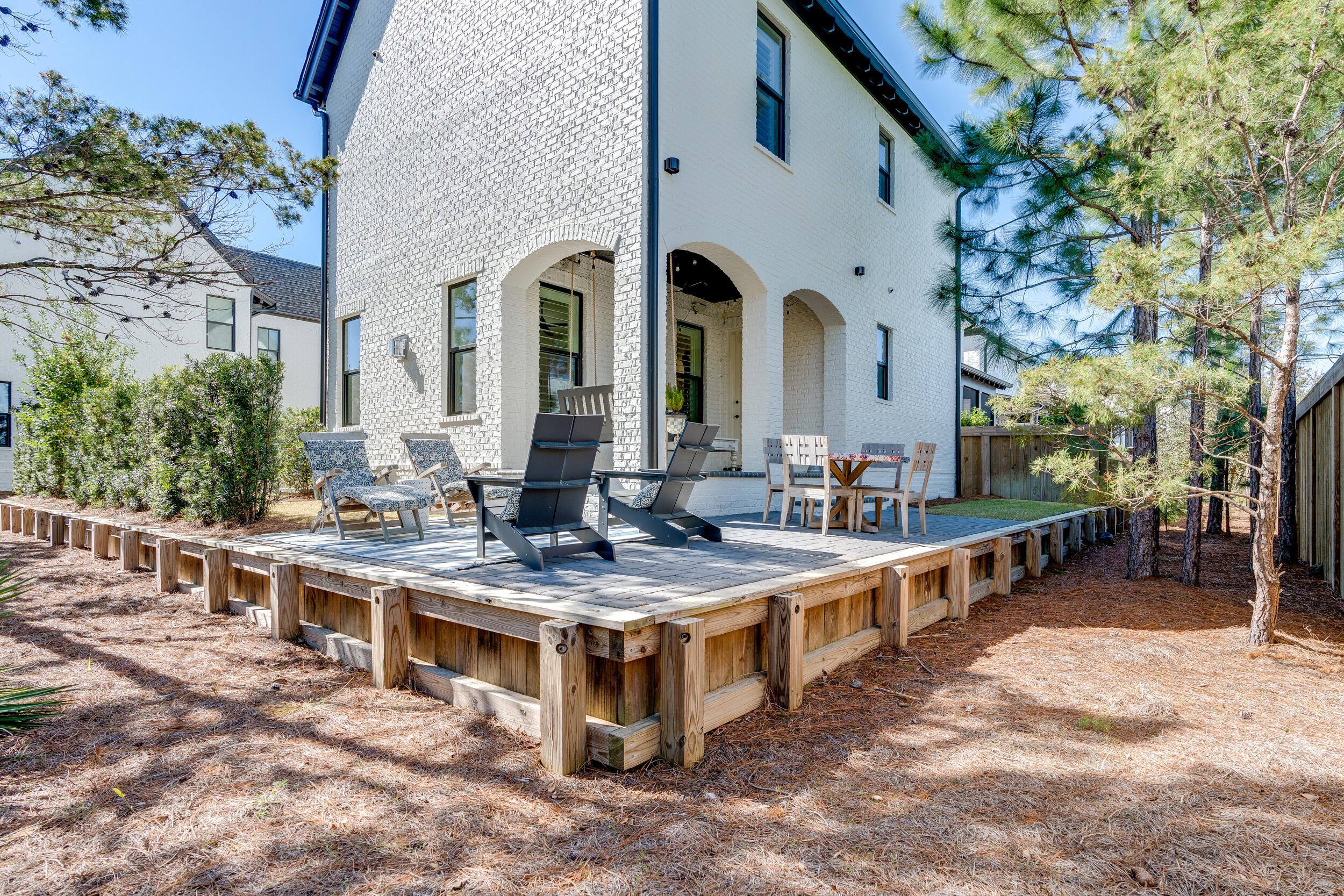 339 Ridgewalk Circle Santa Rosa Beach, FL 32459 - Photo 44 of 57 a view of a house with backyard porch and sitting area