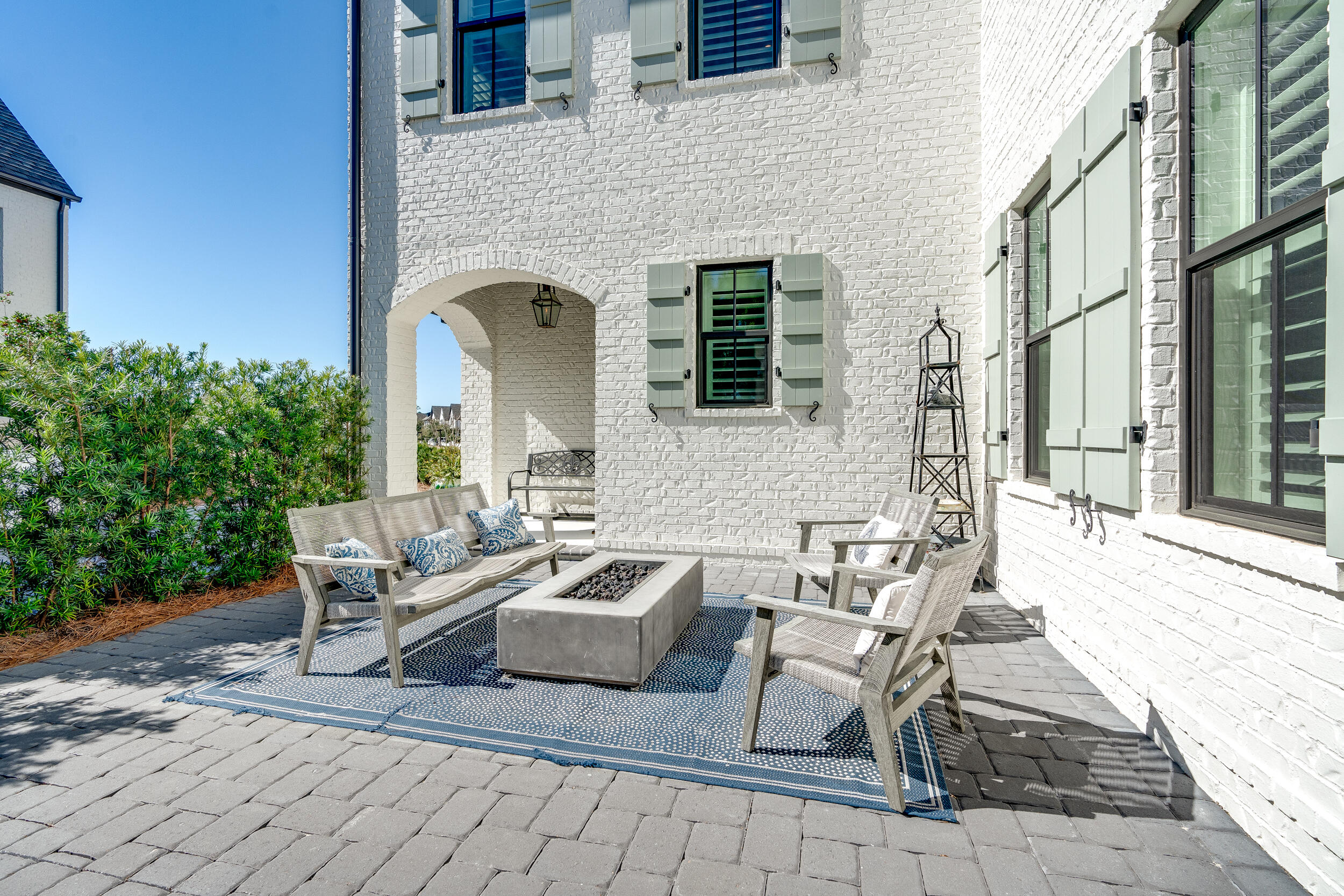 339 Ridgewalk Circle Santa Rosa Beach, FL 32459 - Photo 7 of 57 a view of a patio with couches and potted plants