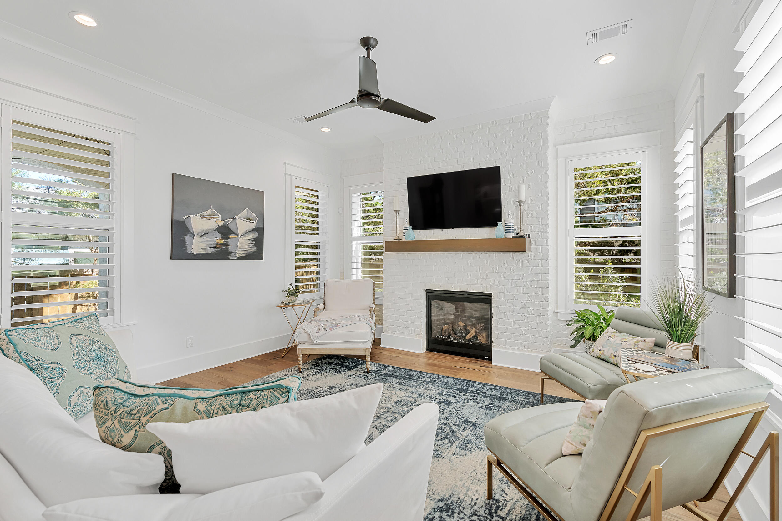 339 Ridgewalk Circle Santa Rosa Beach, FL 32459 - Photo 10 of 57 a living room with furniture a fireplace and a flat screen tv