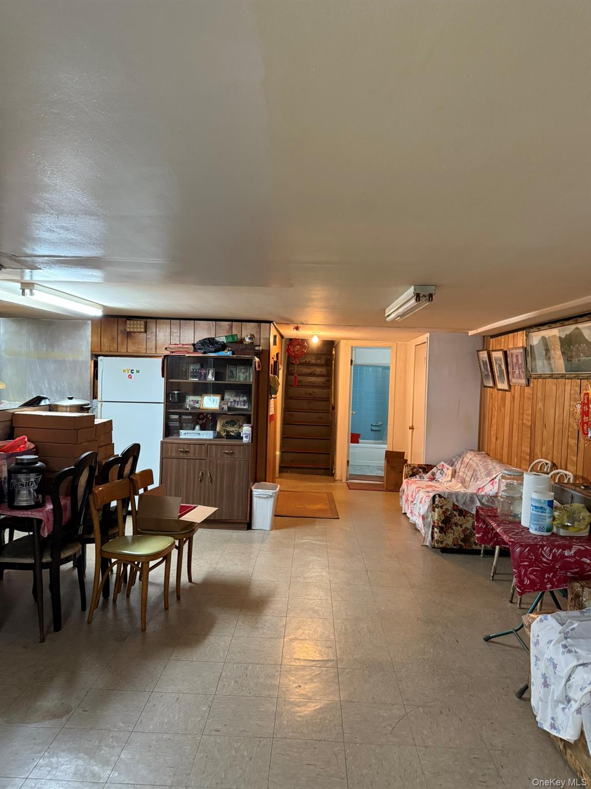 41-38 74th Street Queens, NY 11373 - Photo 15 of 17 a room with furniture and air hockey table