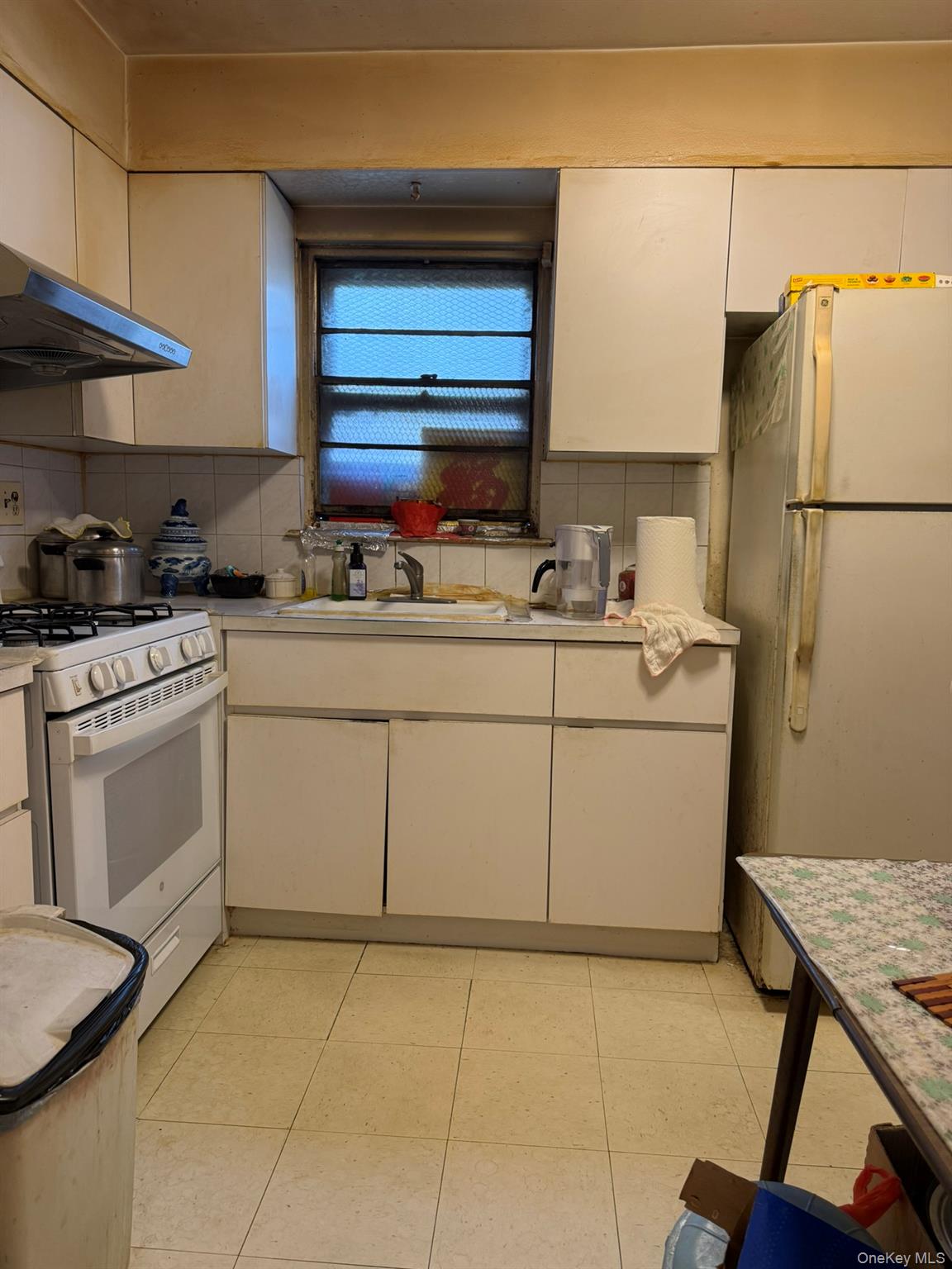 41-38 74th Street Queens, NY 11373 - Photo 6 of 17 a kitchen with a sink cabinets and appliances
