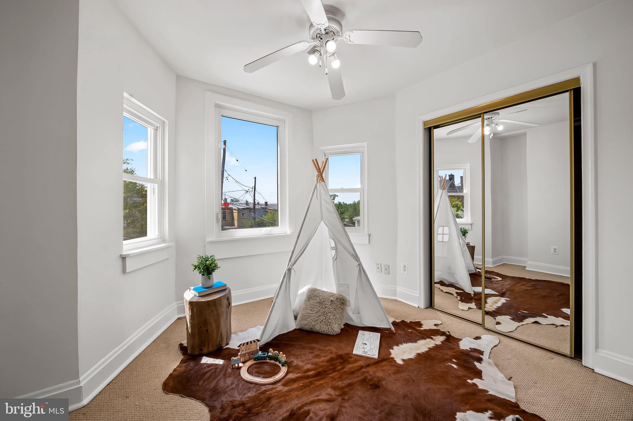 1015 Rectory Lane Baltimore, MD 21211 - Photo 14 of 28 a view of a workspace with furniture and a window