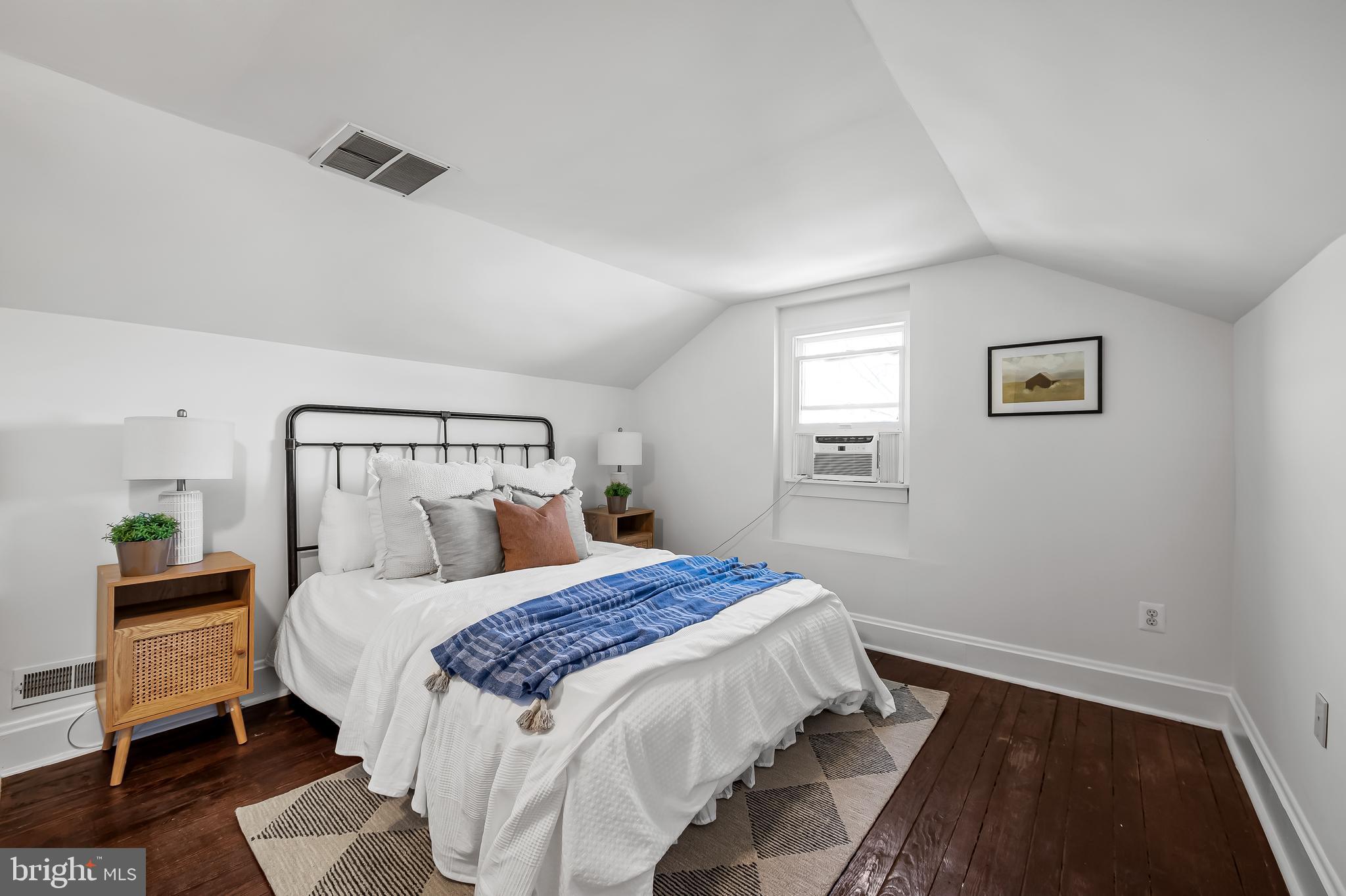 1015 Rectory Lane Baltimore, MD 21211 - Photo 19 of 28 a bedroom with a bed and a window