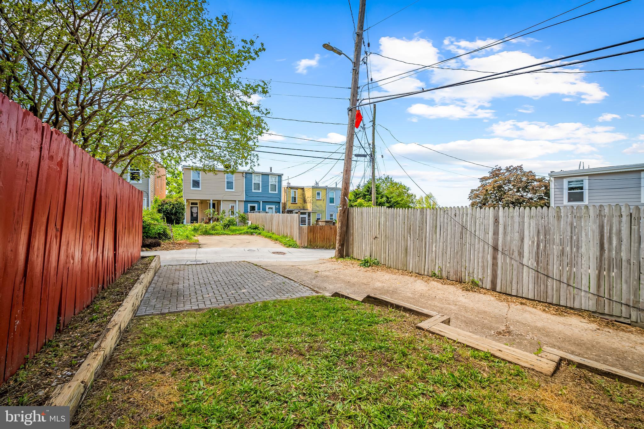 1015 Rectory Lane Baltimore, MD 21211 - Photo 2 of 28 a view of a backyard with wooden fence
