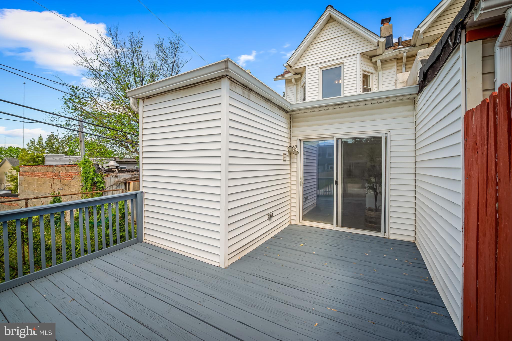 1015 Rectory Lane Baltimore, MD 21211 - Photo 21 of 28 a view of a house with wooden deck