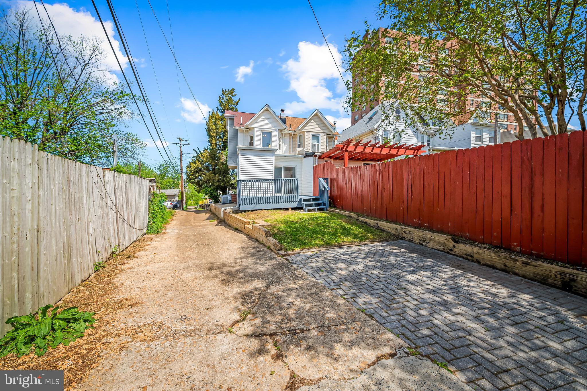1015 Rectory Lane Baltimore, MD 21211 - Photo 22 of 28 a view of a street with a trees