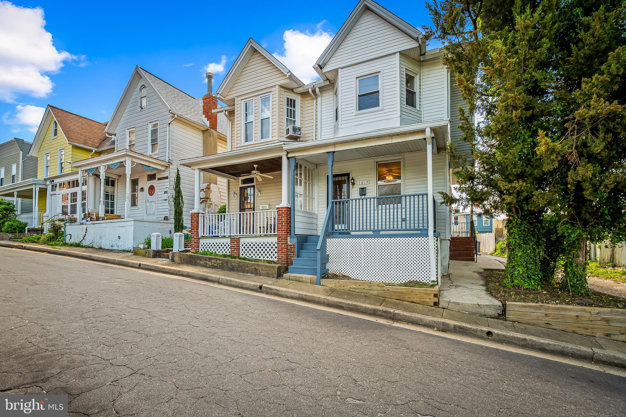 1015 Rectory Lane Baltimore, MD 21211 - Photo 24 of 28 front view of a house with a street