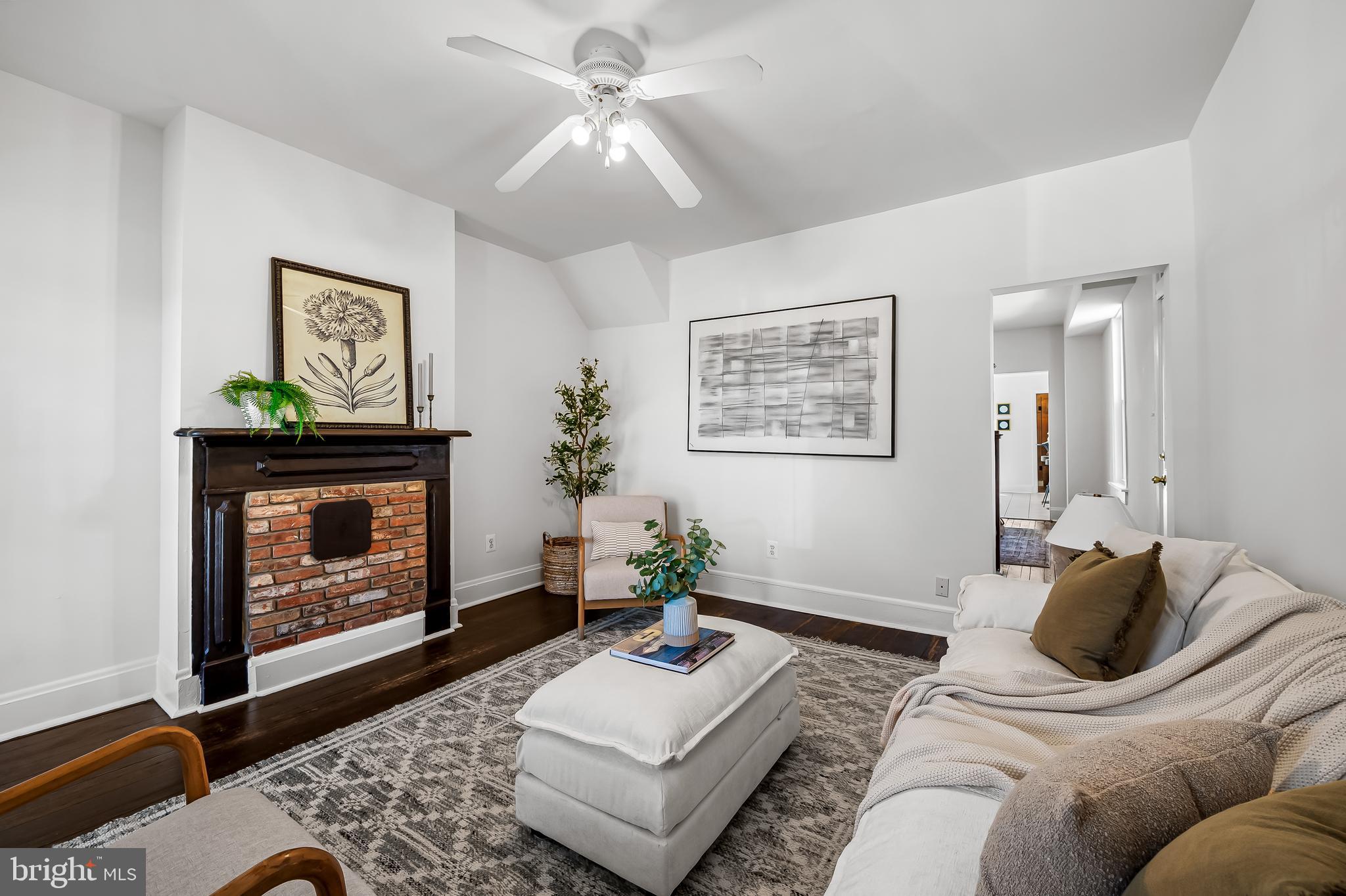 1015 Rectory Lane Baltimore, MD 21211 - Photo 4 of 28 a living room with furniture and a fireplace