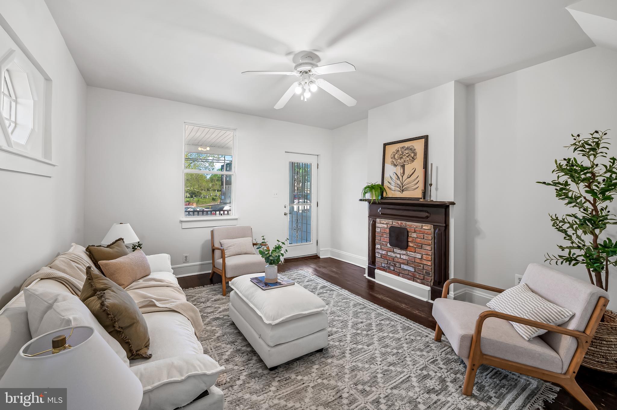 1015 Rectory Lane Baltimore, MD 21211 - Photo 5 of 28 a living room with furniture and a fireplace