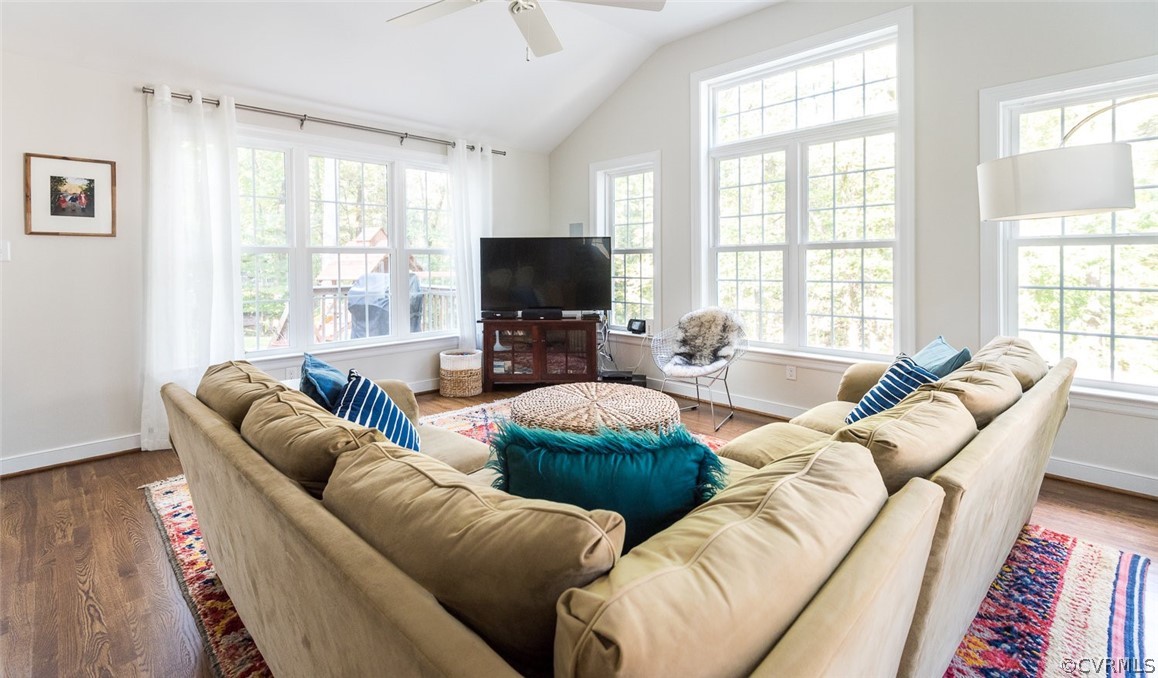 2921 Queenswood Road Midlothian, VA 23113 - Photo 20 of 41 a living room with furniture a flat screen tv and a large window