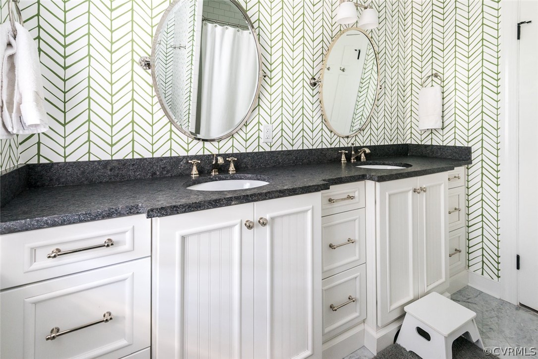 2921 Queenswood Road Midlothian, VA 23113 - Photo 30 of 41 a bathroom with a sink and a mirror