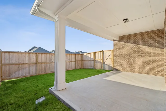 a view of backyard with green space