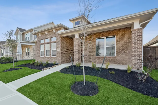 a house that has a garden in front of it