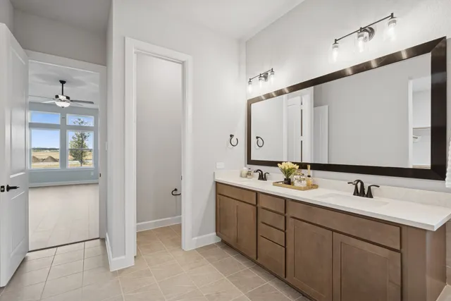 a bathroom with 2 sink and mirror