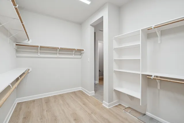a view of an empty walk in closet