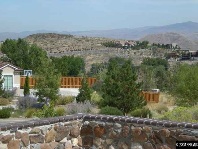 6098 Mesa Road Reno, NV 89511 - Photo 8 of 9 an aerial view of a house with a yard and mountain view in back