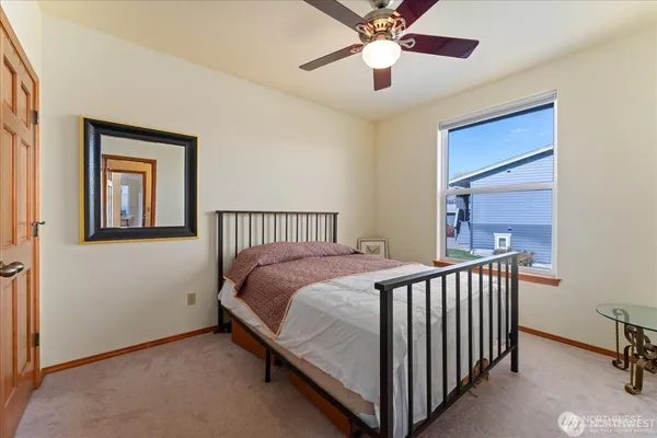 a bathroom with a sink vanity mirror and toilet