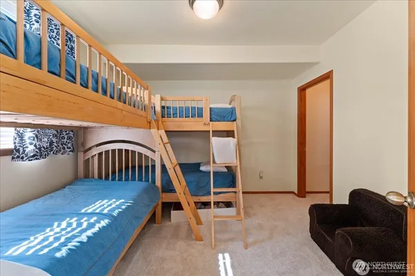 a kitchen with a refrigerator and a stove