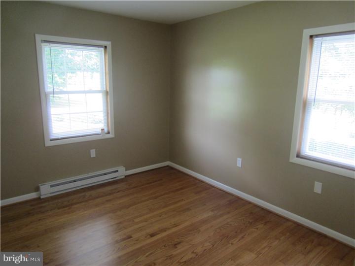 20 Johnstown Road Elkton, MD 21921 - Photo 11 of 23 an empty room with wooden floor and windows