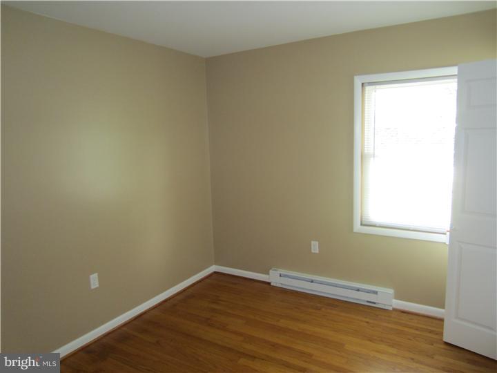 20 Johnstown Road Elkton, MD 21921 - Photo 12 of 23 an empty room with wooden floor and windows