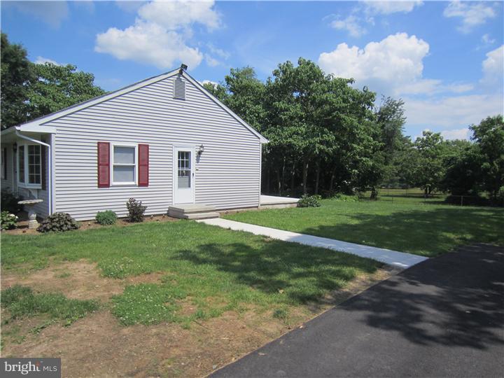 20 Johnstown Road Elkton, MD 21921 - Photo 20 of 23 a view of a backyard with plants and large tree