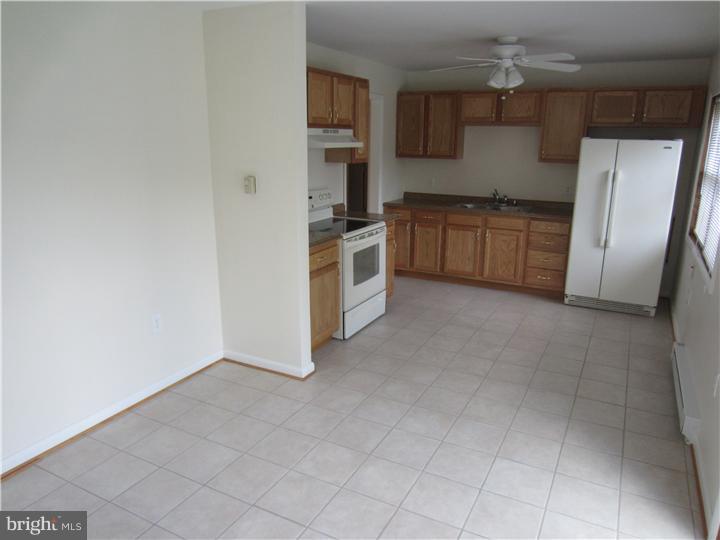20 Johnstown Road Elkton, MD 21921 - Photo 3 of 23 a kitchen with stainless steel appliances a refrigerator and a stove top oven