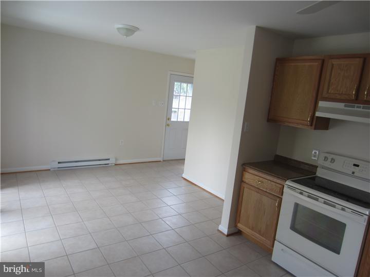 20 Johnstown Road Elkton, MD 21921 - Photo 4 of 23 a kitchen with a stove top oven and cabinets