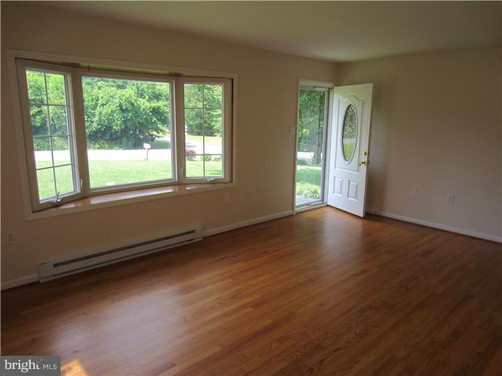 20 Johnstown Road Elkton, MD 21921 - Photo 5 of 23 a view of an empty room with wooden floor and a window