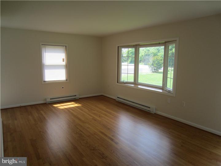 20 Johnstown Road Elkton, MD 21921 - Photo 7 of 23 an empty room with wooden floor and windows