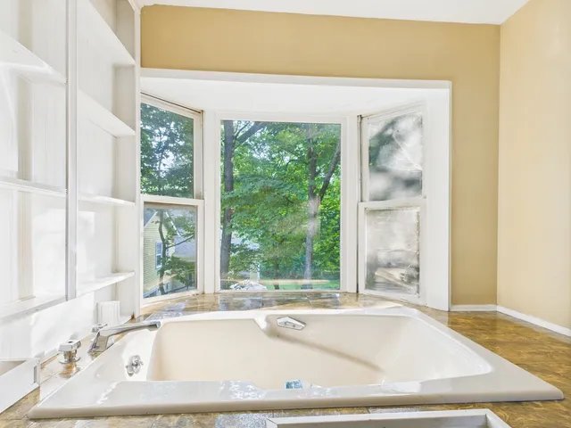 a bathroom with a sink vanity and a mirror