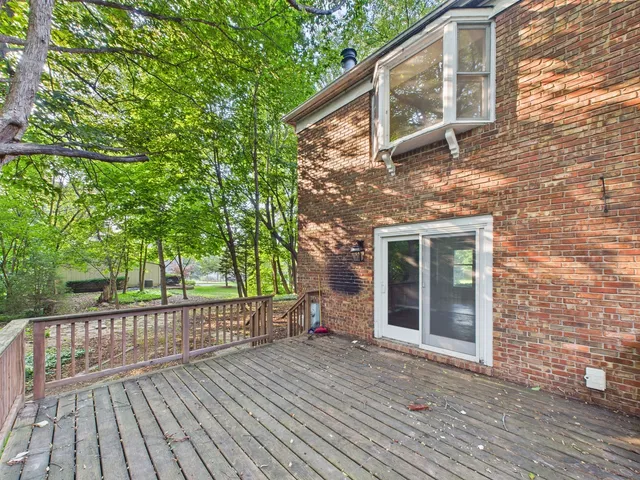 a view of house with a yard