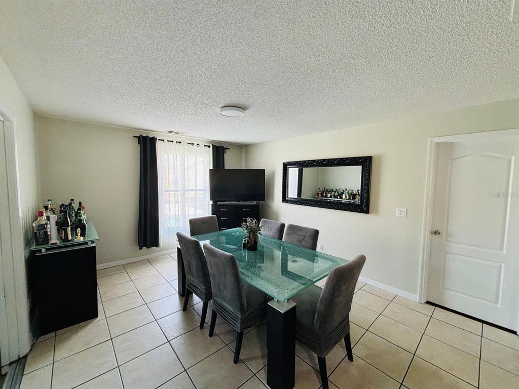 1464 Howland Boulevard Deltona, FL 32738 - Photo 12 of 55 a view of a dining room with furniture