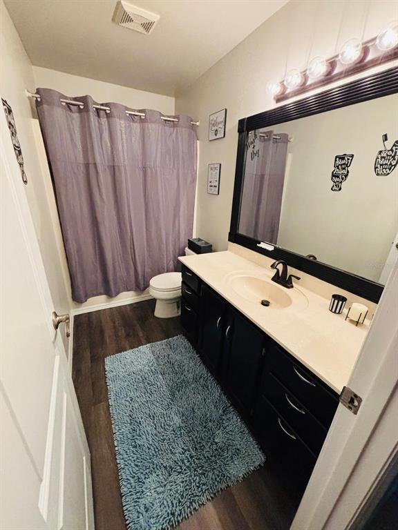 1464 Howland Boulevard Deltona, FL 32738 - Photo 21 of 55 a bathroom with a double vanity sink and mirror