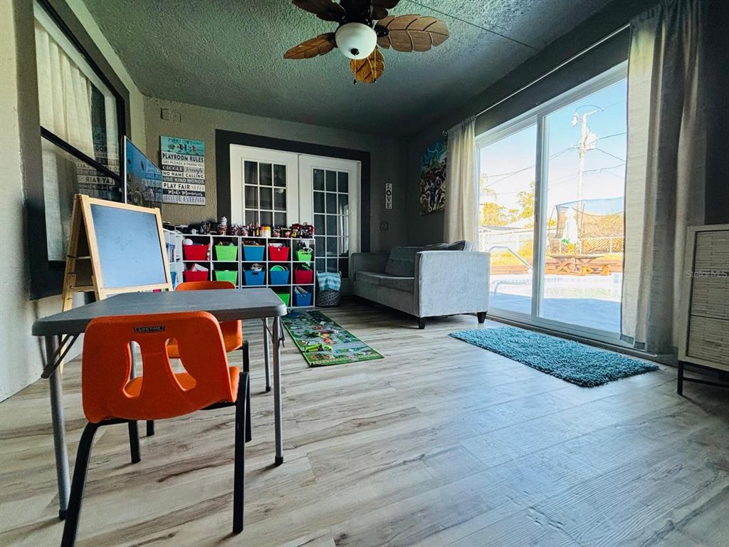 1464 Howland Boulevard Deltona, FL 32738 - Photo 26 of 55 a workspace with furniture window and wooden floor